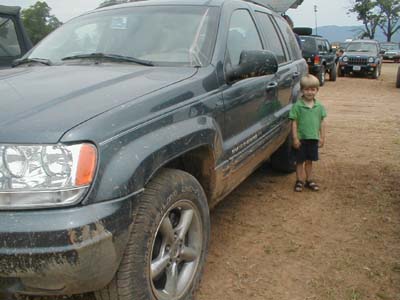 Avyn Next To Muddy Jeep