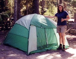 Tam standing by tent